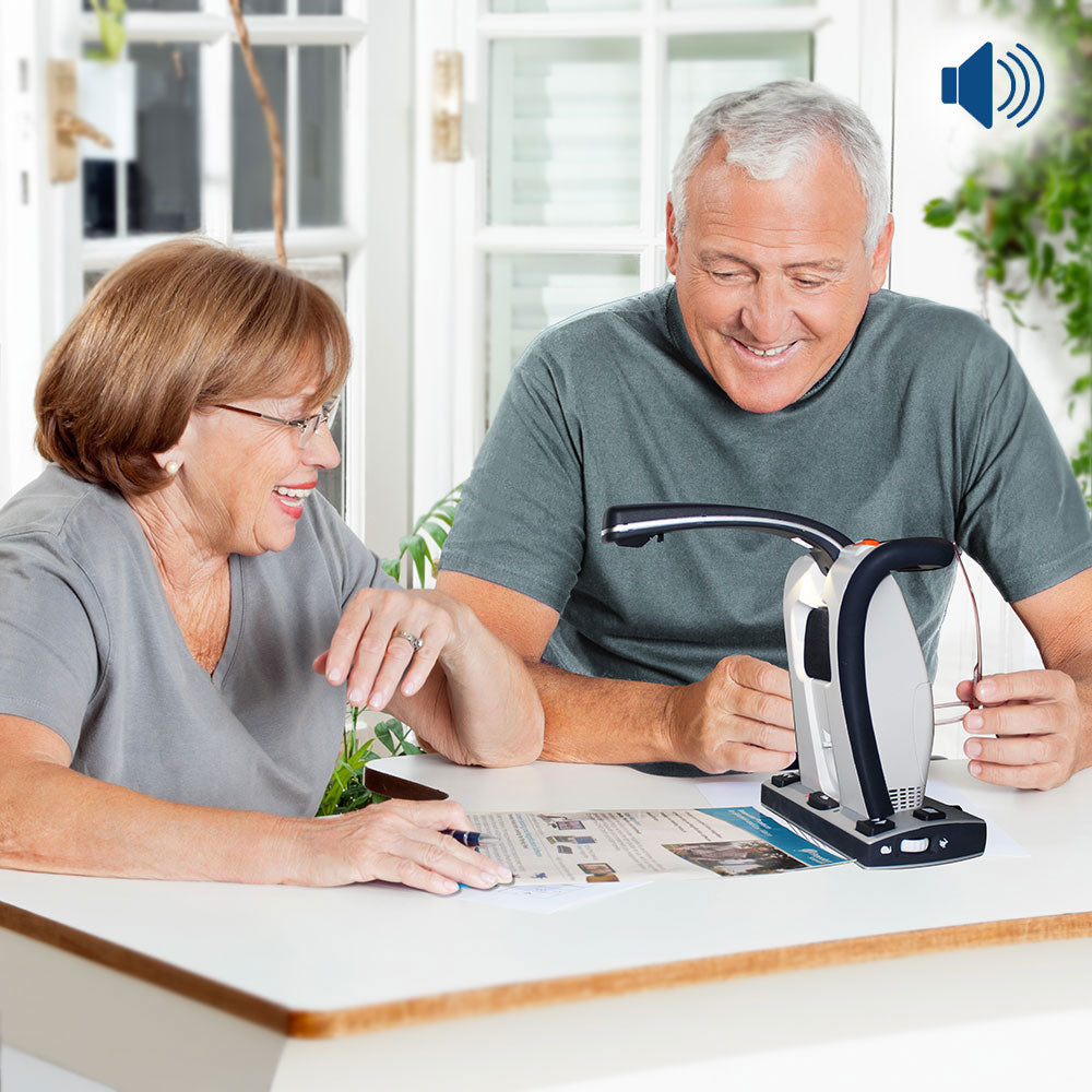 Older couple listening as Smart Reader HD reads a document aloud