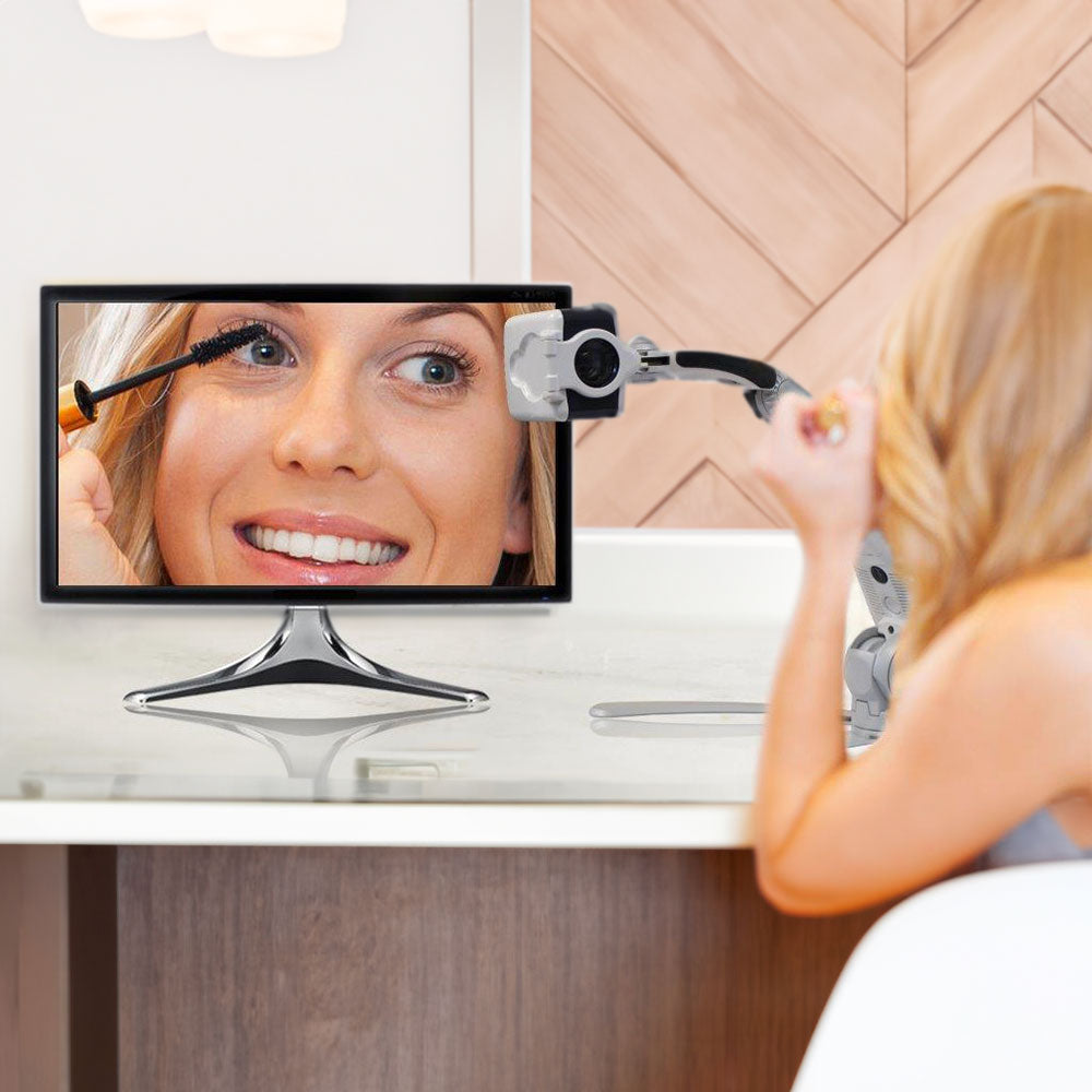 Woman using Transformer self-view to apply makeup