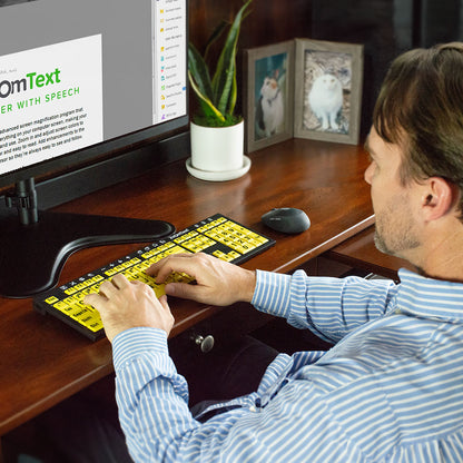 Man using Zoomtext keyboard at home office desk